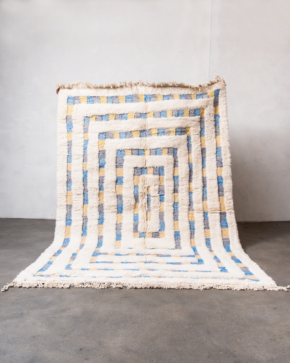 Modern, designer, handcrafted Berber rug from Morocco. Beniourain carpet with beautiful colours and patterns and fluffy wool texture.